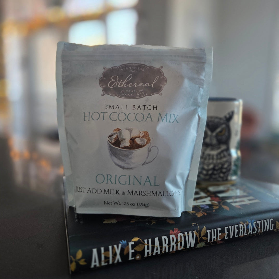 Hot cocoa mix packet on a shelf with blurred background