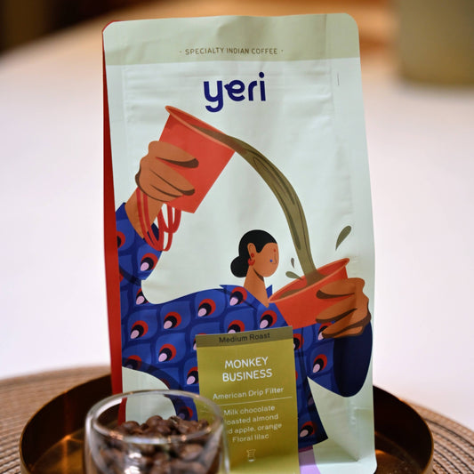 Yeri coffee package with a glass of coffee beans on a wooden tray