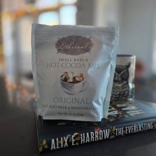 Hot cocoa mix packet on a shelf with blurred background