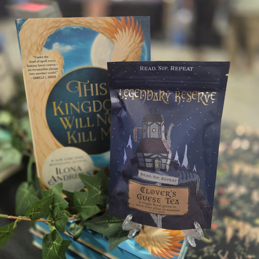 Tea package with book titled 'This Kingdom Will Not Kill' in a blurred indoor setting